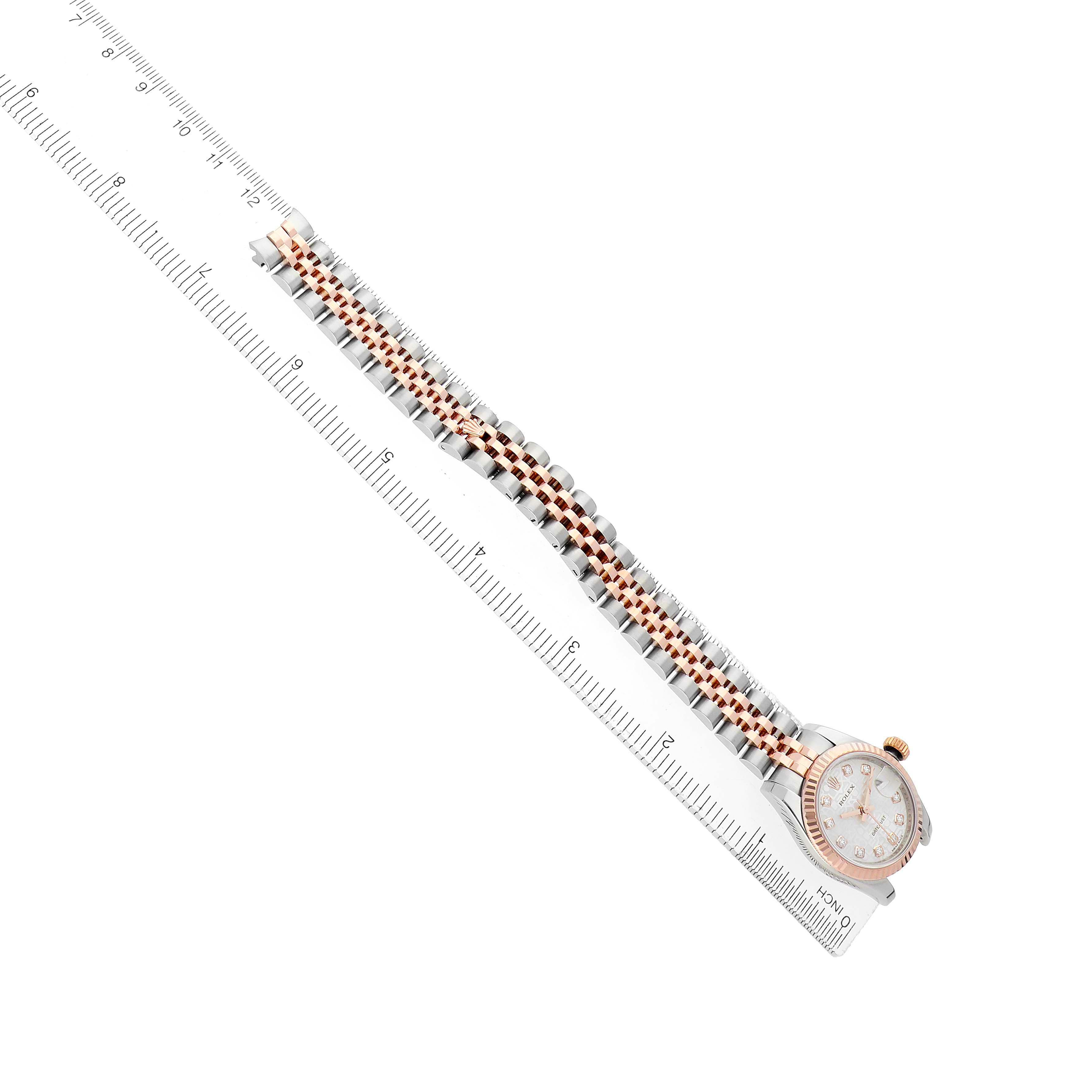 The Rolex Datejust 179171 Women's Stainless Steel Silver Dial watch is displayed at an angle, showing the full bracelet and part of the dial, alongside a ruler for scale.