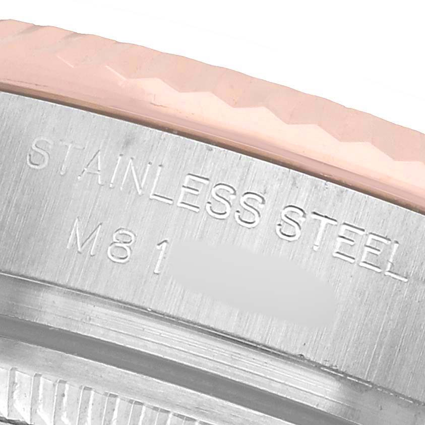 The image shows a close-up of the Rolex Datejust 179171 Women's Stainless Steel Silver Dial's stainless steel case with engraving details.