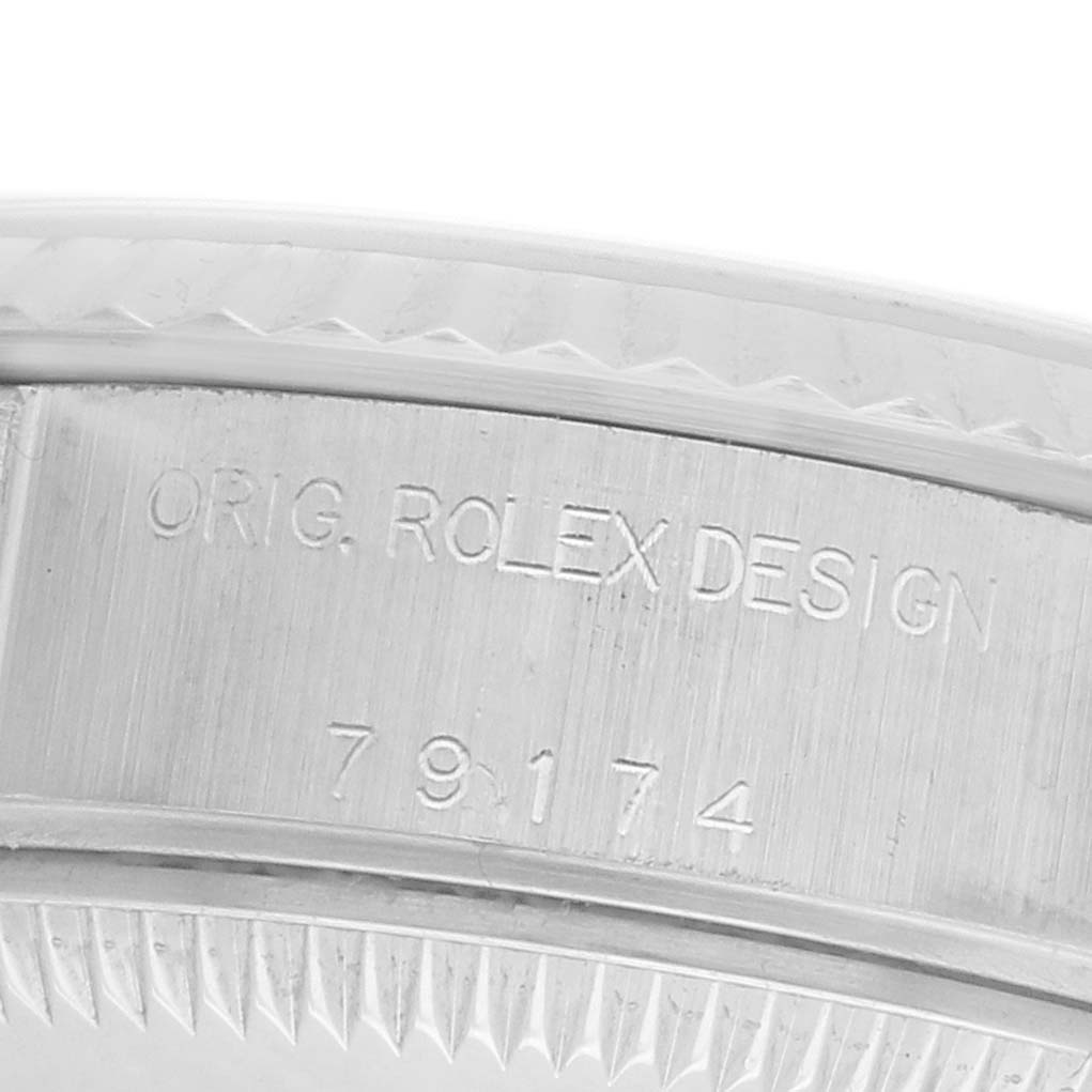 The image shows a close-up angle of the inner bezel of a Rolex Datejust 79174 Women's Stainless Steel Mother of Pearl Dial, displaying the model number and "Orig. Rolex Design" engraving.