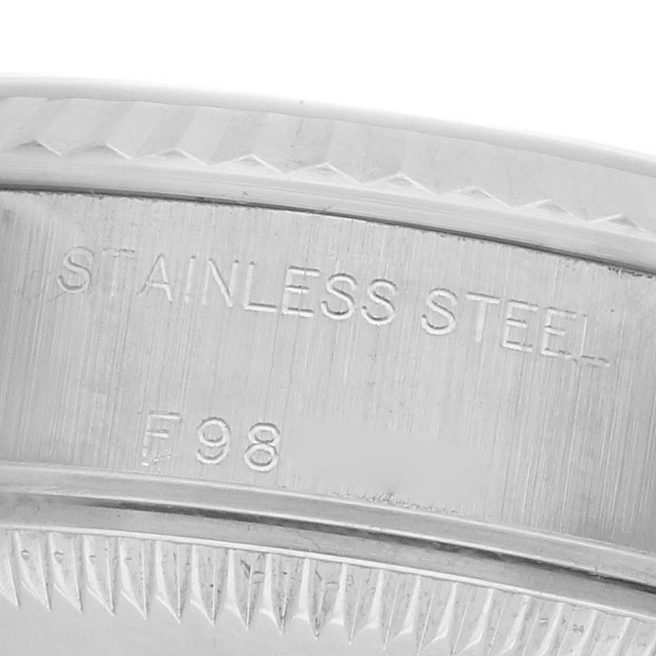 The image shows a close-up of the Rolex Datejust 79174 Women's Stainless Steel Mother of Pearl Dial's stainless steel case side, highlighting engravings.