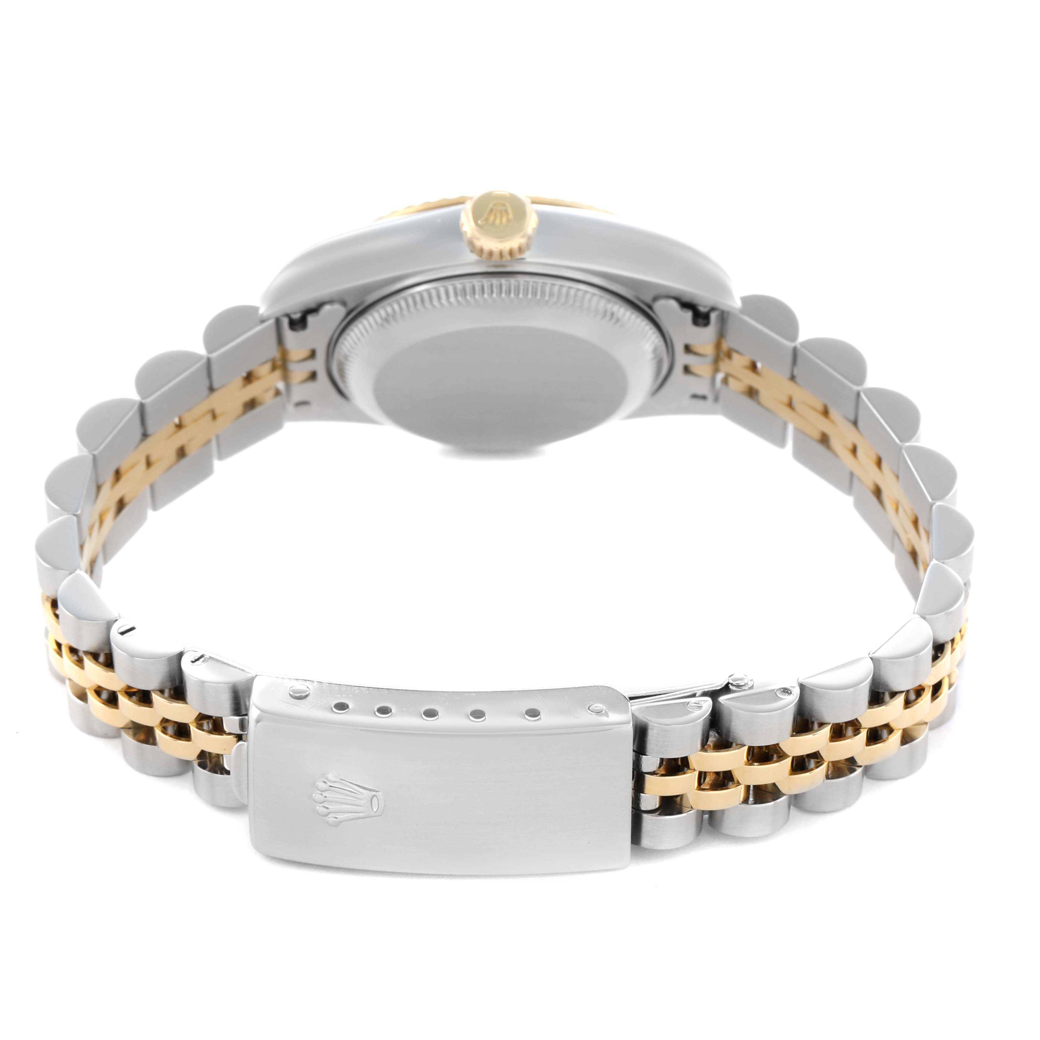The image shows the back view of a Rolex Datejust 79173 Women's Steel and Gold (two tone) Champagne Dial, highlighting its case back, crown, and two-tone bracelet with clasp.
