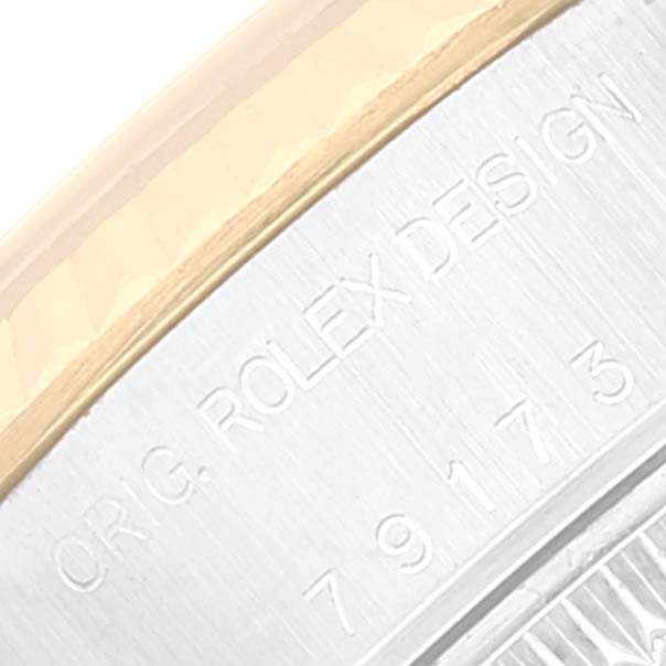 The image shows a close-up of the side engraving on a Rolex Datejust 79173 Women's Steel and Gold (two tone) Beige Dial 79173 Women's Steel and Gold (two tone) Beige Dial watch.