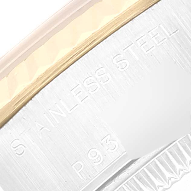 The image shows a close-up of the engraved bezel on a Rolex Datejust 79173 Women's Steel and Gold (two tone) Beige Dial 79173 Women's Steel and Gold (two tone) Beige Dial watch, highlighting "STAINLESS STEEL" and some of the serial number.