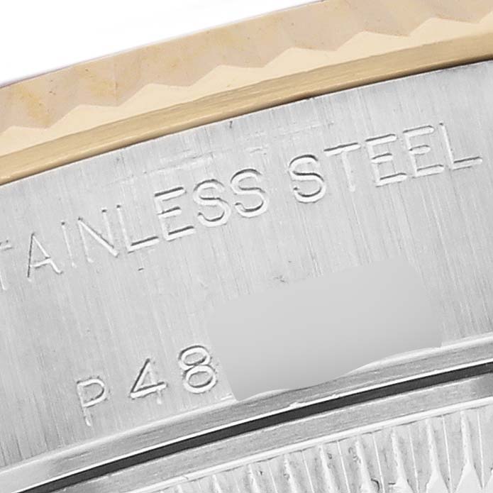 The image shows a close-up of the Rolex Datejust 79173 Women's Steel and Gold (two tone) Grey Dial 79173 Women's Steel and Gold (two tone) Grey Dial's stainless steel case back with engraved text.