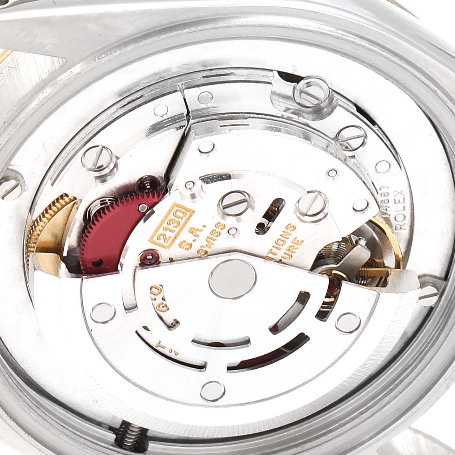 This image shows a close-up of the inner mechanism and movement parts of a Rolex Mid-Size 67513 Women's Steel and Gold (two tone) Blue Dial 67513 Women's Steel and Gold (two tone) Blue Dial model watch.