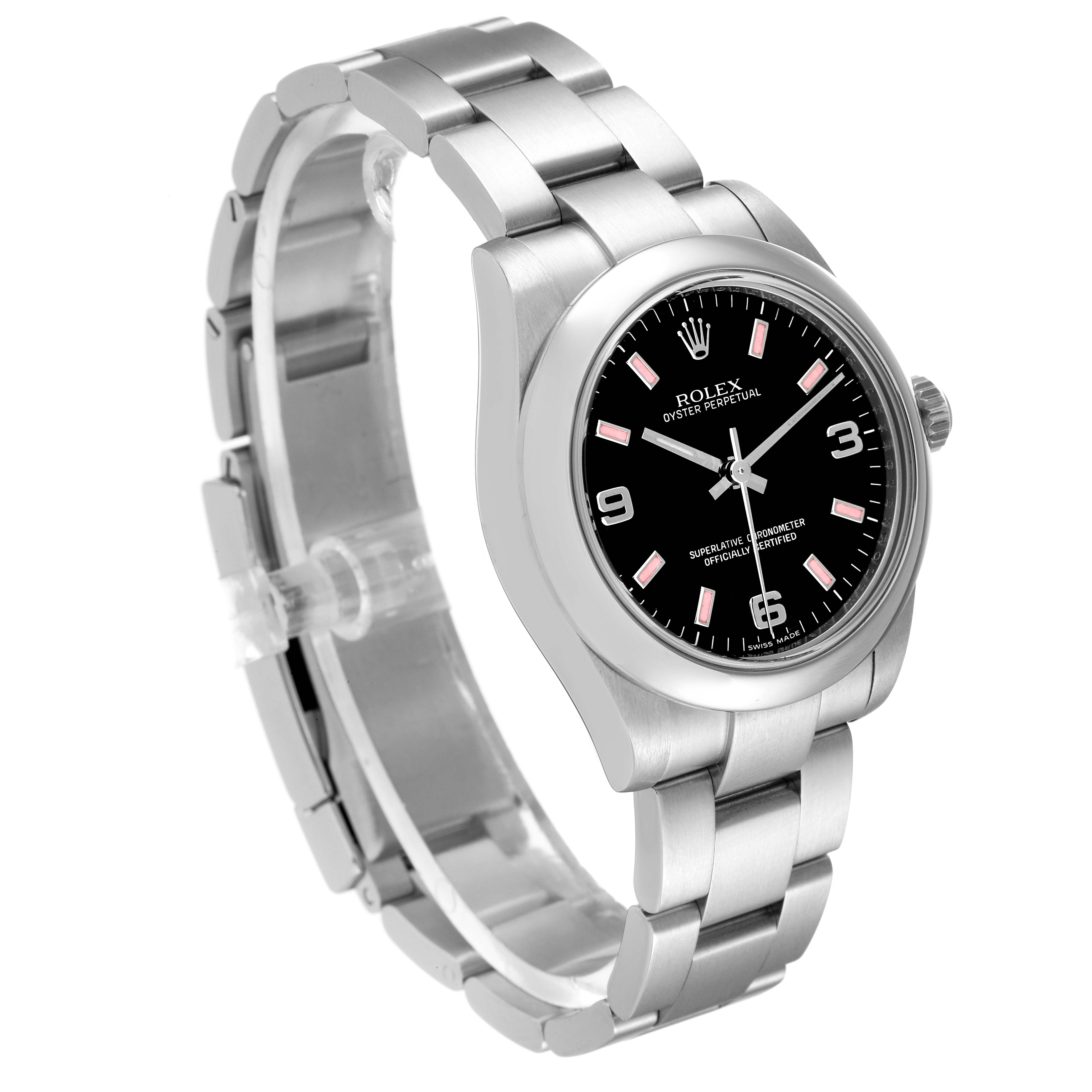 The image shows a Rolex Oyster Perpetual Mid-Size watch at an oblique angle, highlighting the bracelet and black dial.