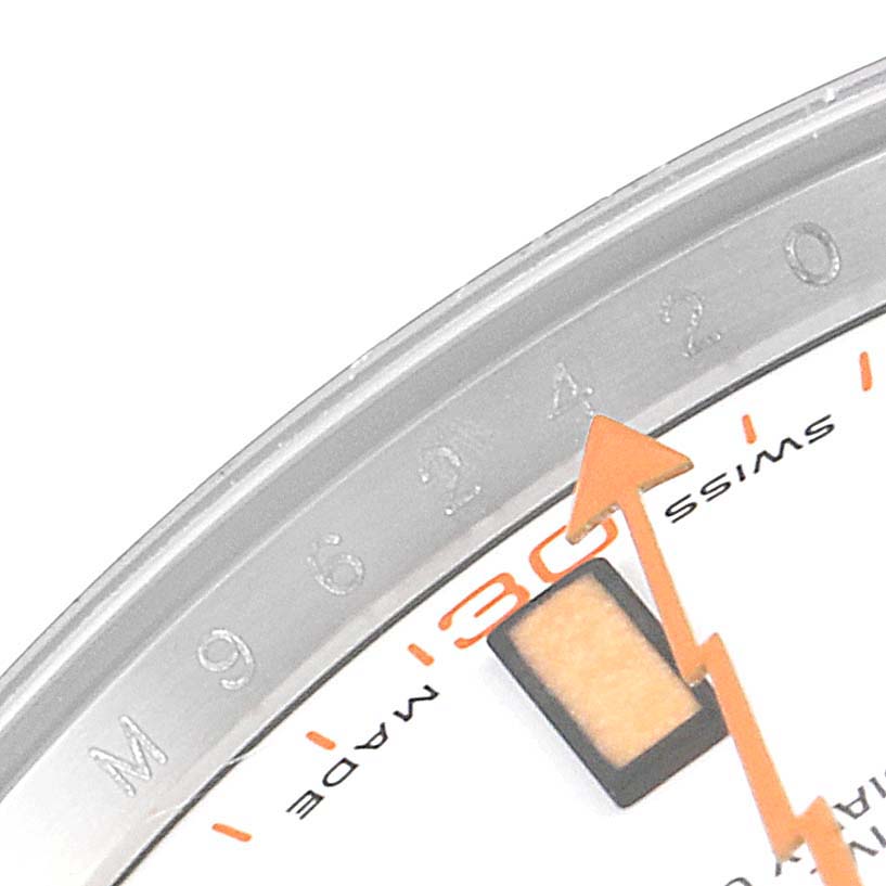This image shows a close-up of the Rolex Milgauss 116400V Men
s Stainless Steel White Dial 116400V Men
s Stainless Steel White Dial watch dial, highlighting its orange seconds hand and numerical markings.