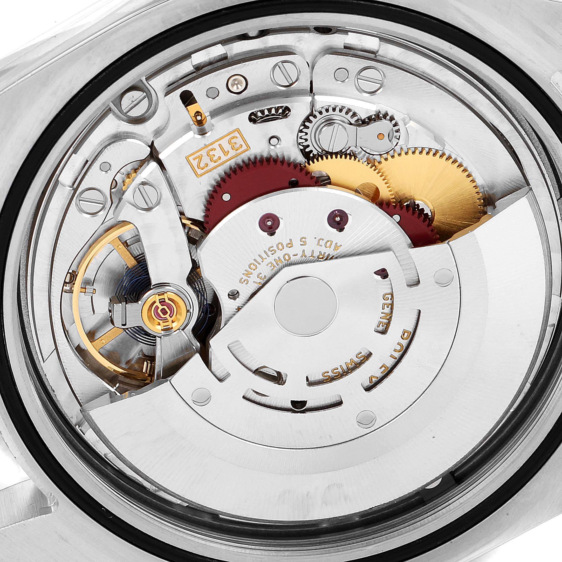 This close-up image shows the intricate mechanical movement of a Rolex Oyster Perpetual 114300 Men
s Stainless Steel Black Dial 114300 Men
s Stainless Steel Black Dial watch.