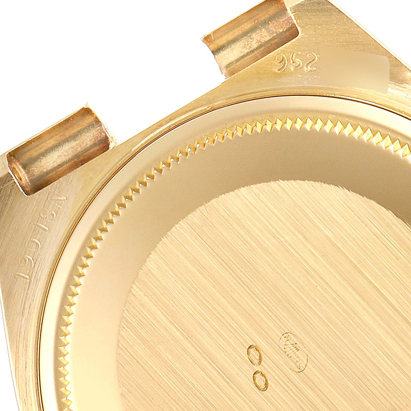 The image shows a close-up top view of the back case of a Rolex Oysterquartz 19018 Men's Yellow Gold Champagne Dial 19018 Men's Yellow Gold Champagne Dial watch.