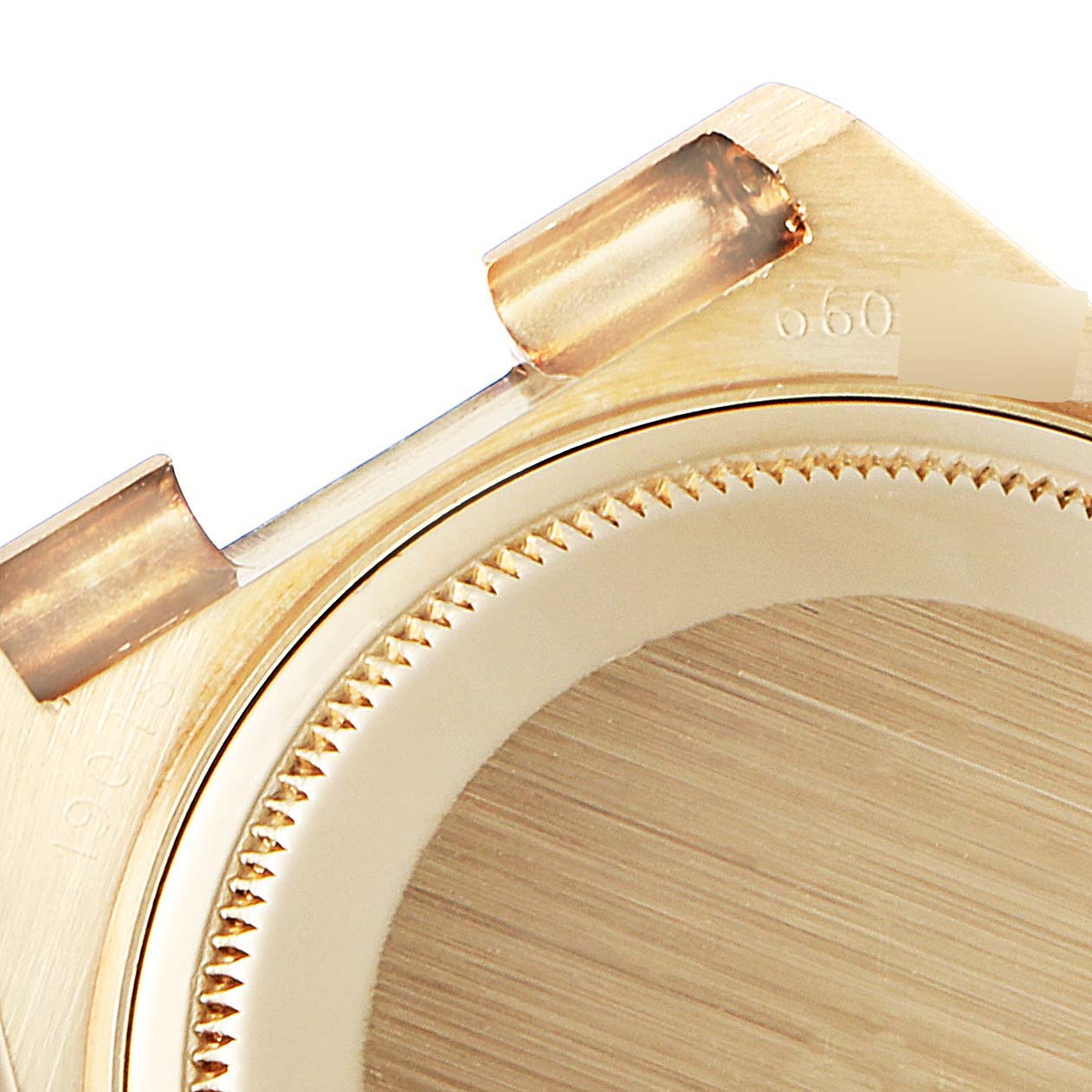 This image shows a close-up of the case back and lugs of a Rolex Oysterquartz 19018 Men's Yellow Gold Champagne Dial 19018 Men's Yellow Gold Champagne Dial watch.