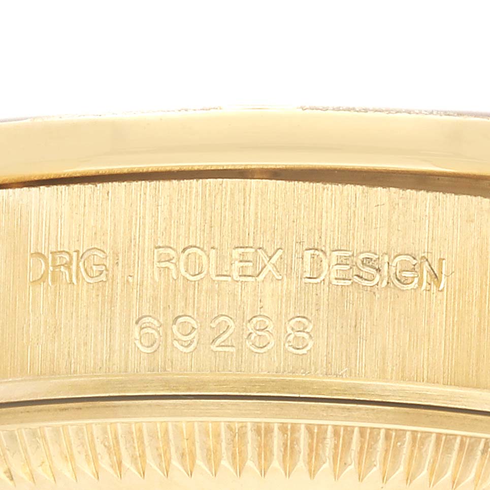 The image shows a close-up of the side of a Rolex President 69288 Women's Yellow Gold Champagne Dial model, highlighting its engraved design reference.