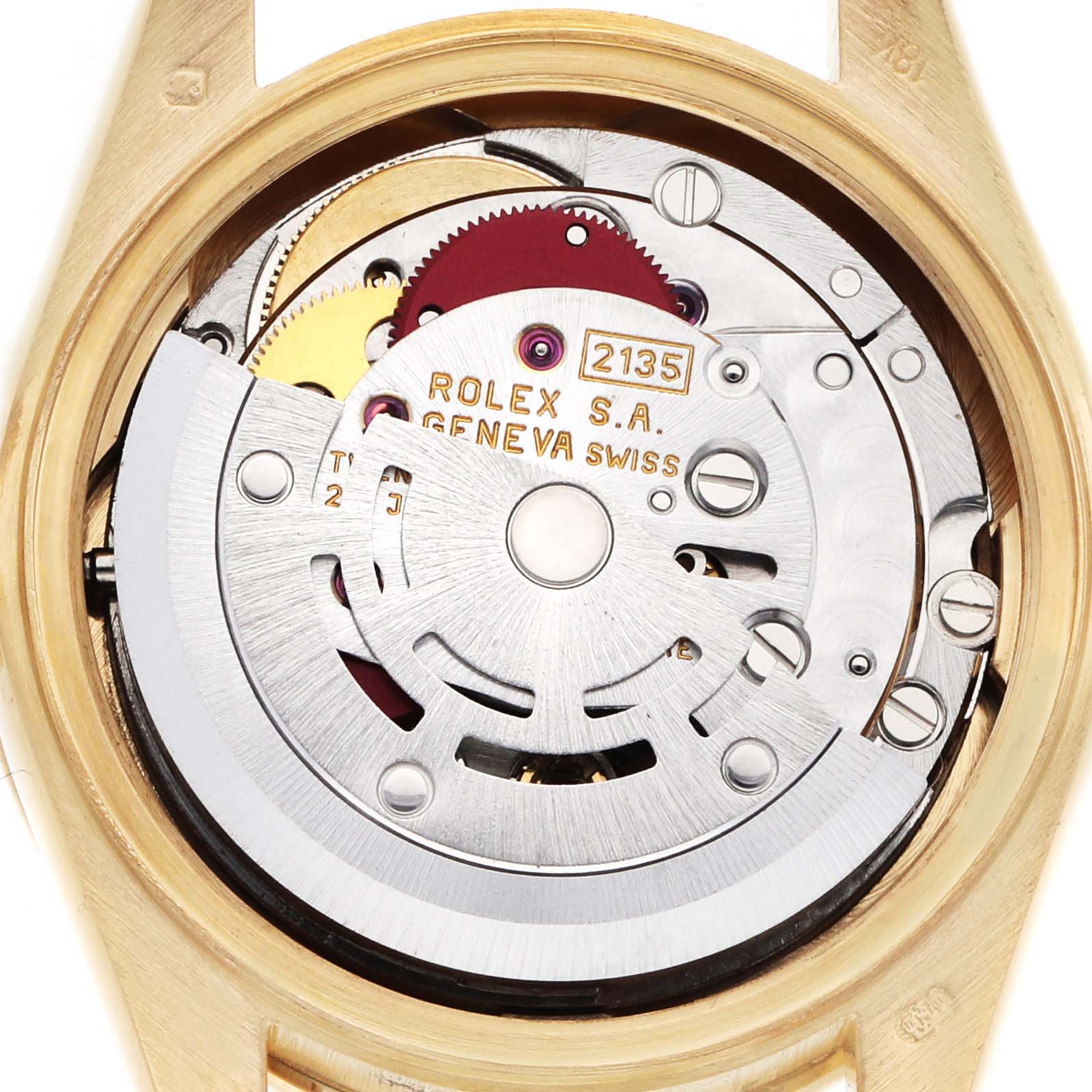 The image shows the inner movement mechanism of a Rolex President 69288 Women's Yellow Gold Champagne Dial watch from the back, highlighting gears and engraved details.