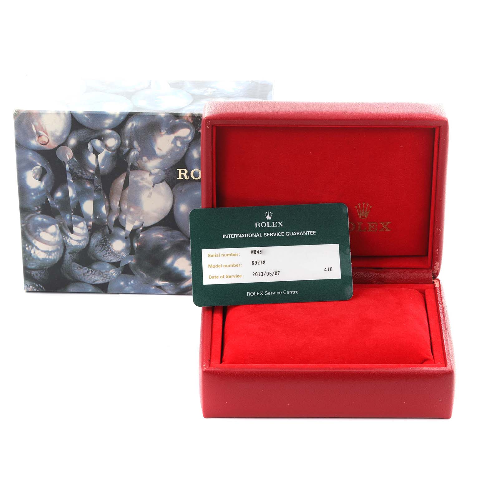 The image shows a Rolex President 69278 Women's Yellow Gold Champagne Dial 69278 Women's Yellow Gold Champagne Dial model box and an international service guarantee card.