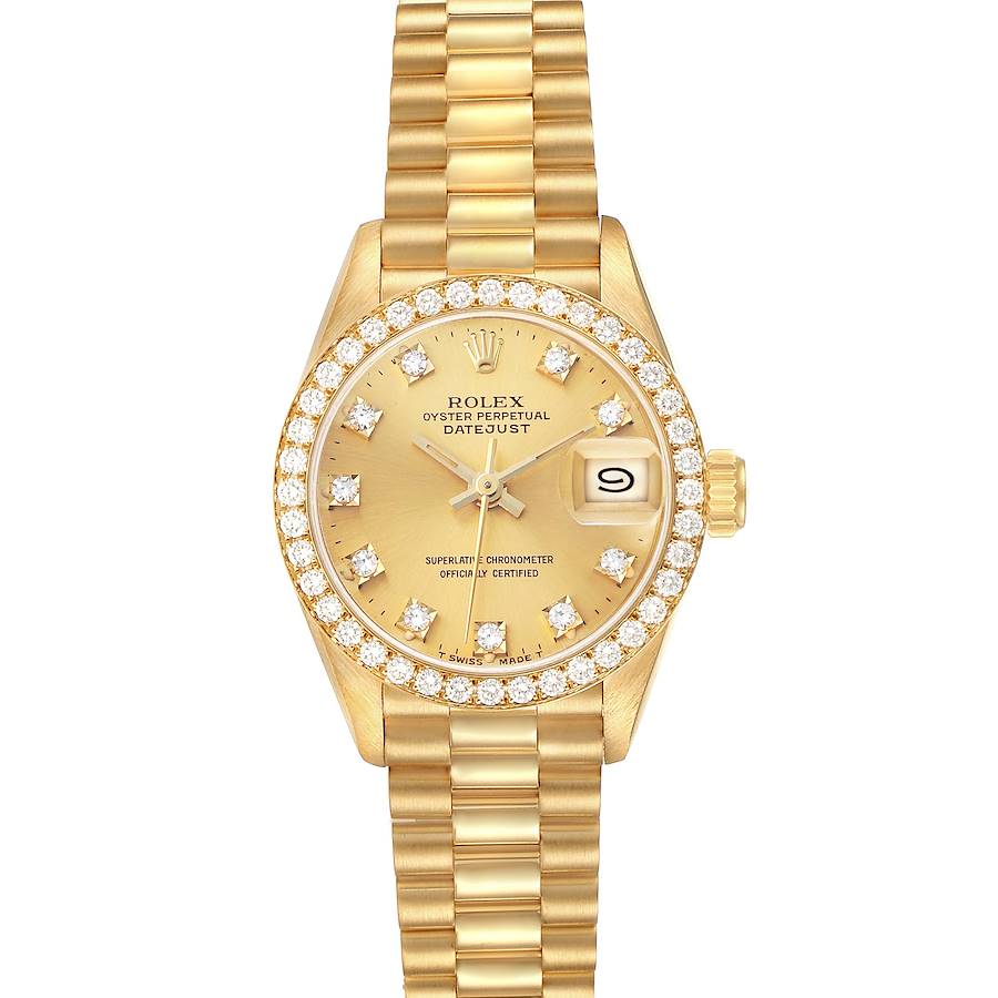 The Rolex President 69138 Women's Yellow Gold Champagne Dial model watch is shown from a top view, displaying its gold bracelet, diamond bezel, and dial with date feature.