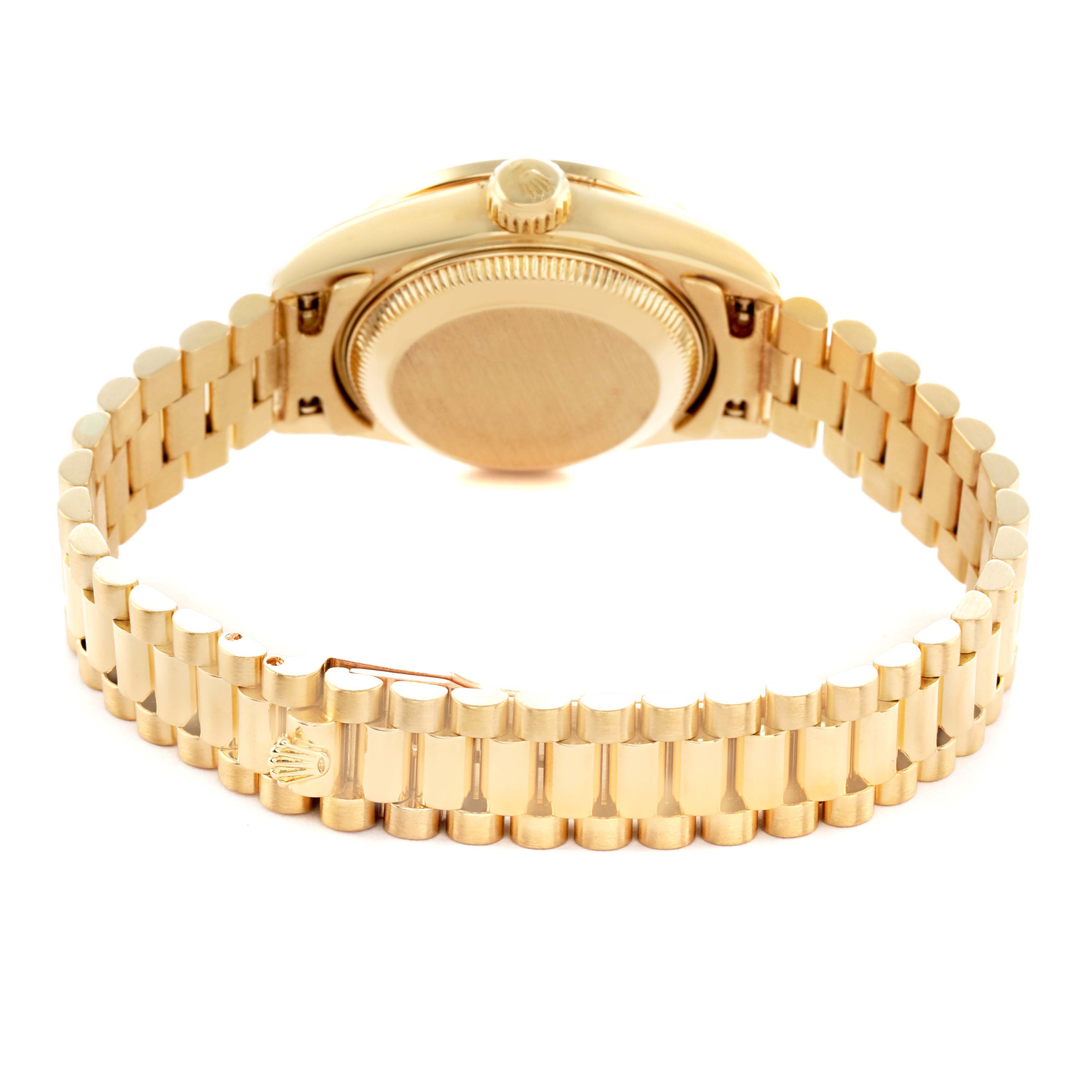 The Rolex President 69138 Women's Yellow Gold Champagne Dial model is shown from the rear angle, highlighting the bracelet and case back.