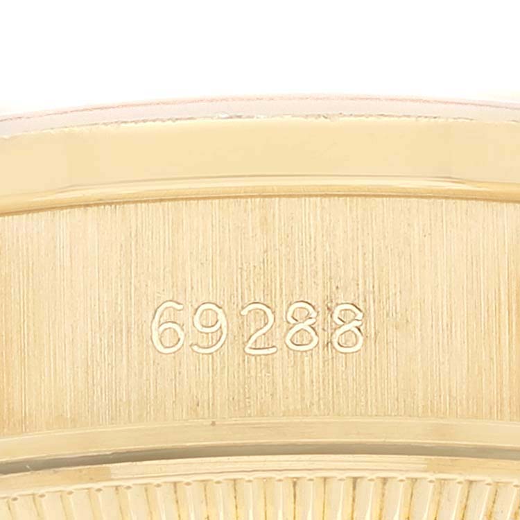 This close-up image shows the side of the bezel and casing, with the model number 69288, of a Rolex President 69288 Women
s Yellow Gold Champagne Dial 69288 Women
s Yellow Gold Champagne Dial watch.