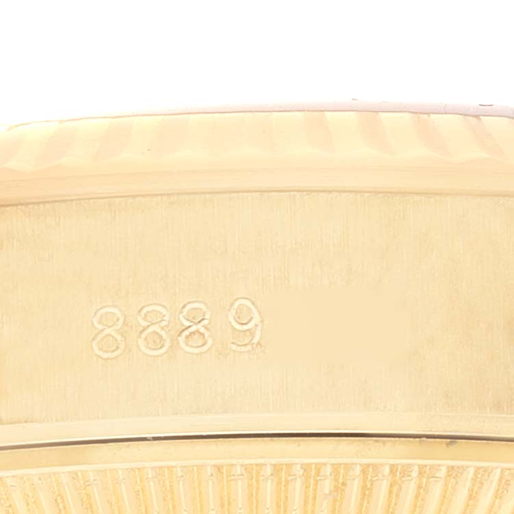 This image shows a close-up of the side of the Rolex President 69178 Women
s Yellow Gold Champagne Dial 69178 Women
s Yellow Gold Champagne Dial model watch case, featuring engraved numbers.