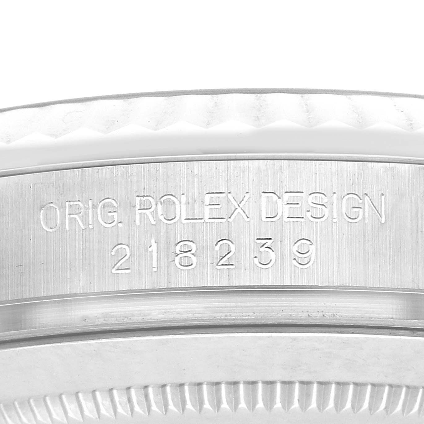 This close-up shows the engraved outer case side of a Rolex President 218239 Men's White Gold Brown Dial watch, displaying "ORIG. ROLEX DESIGN 218239."