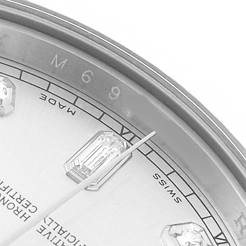 The close-up image shows the dial, bezel, and part of a diamond hour marker of a Rolex President 218239 Men's White Gold Silver Dial watch.