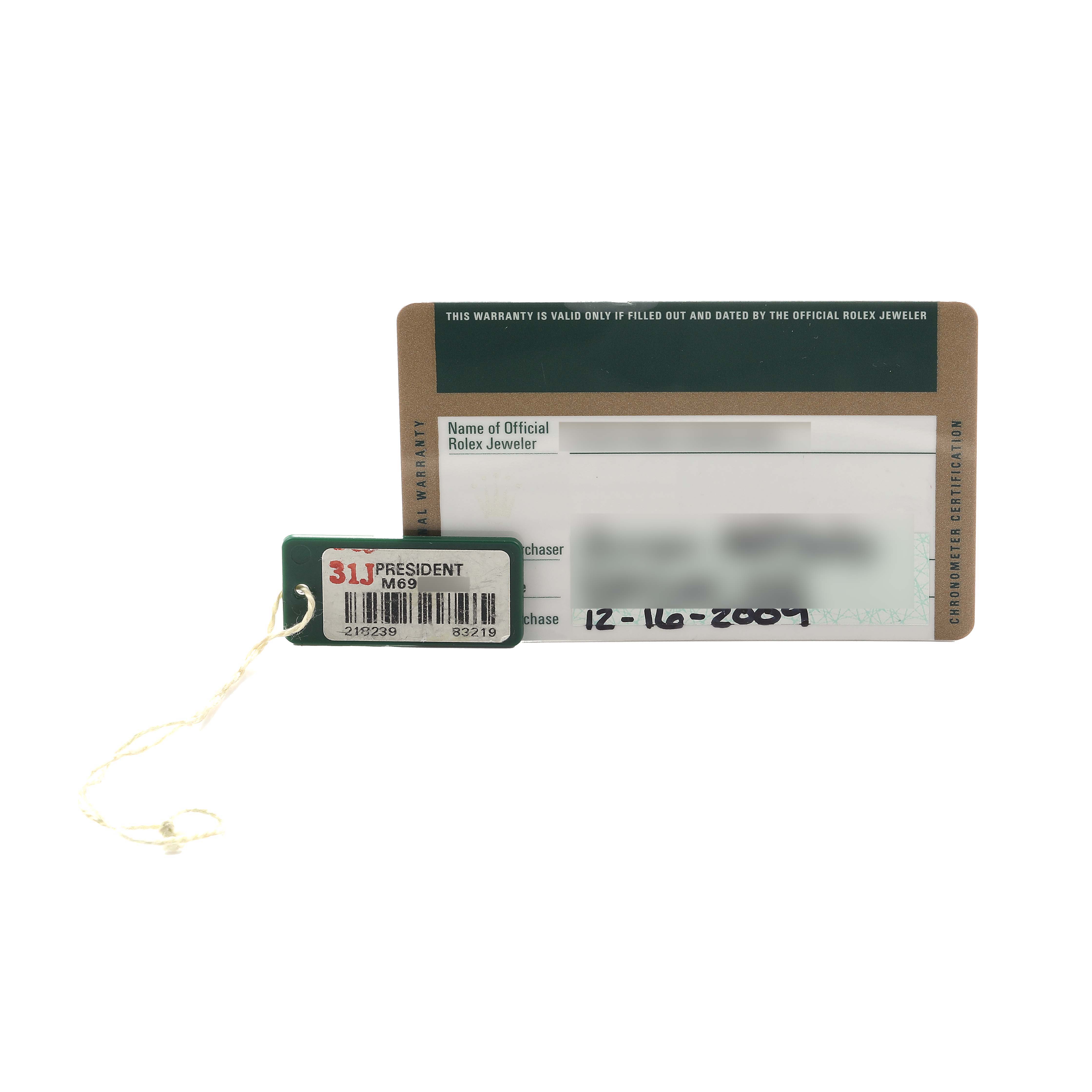 The image shows a Rolex President 218239 Men's White Gold Silver Dial model warranty card and a hang tag with model details.