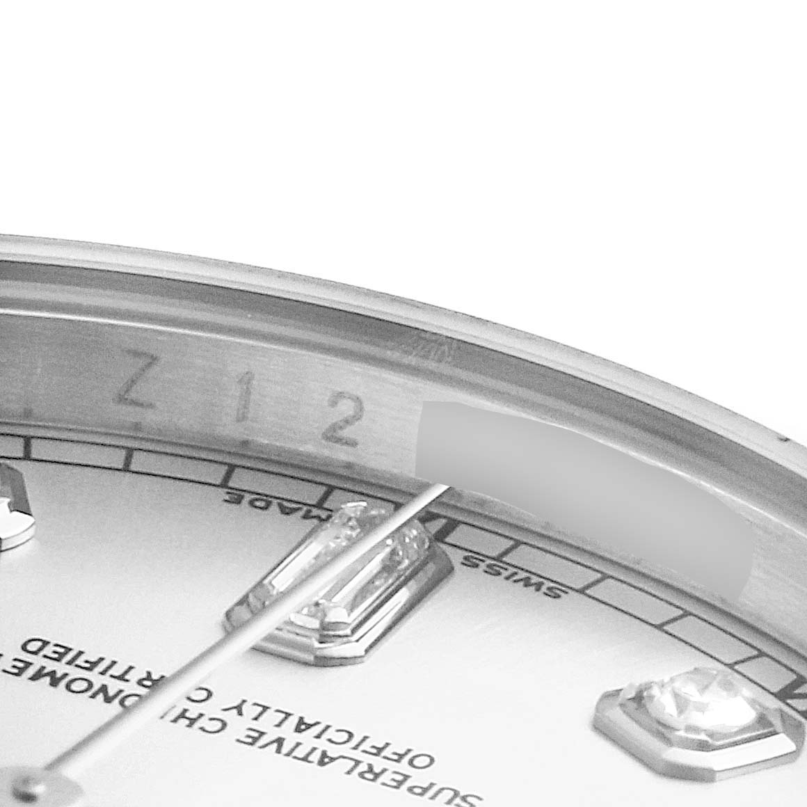 The image shows a close-up of the serial number and part of the dial of a Rolex President 118206 Men's Platinum Silver Dial 118206 Men's Platinum Silver Dial model watch.