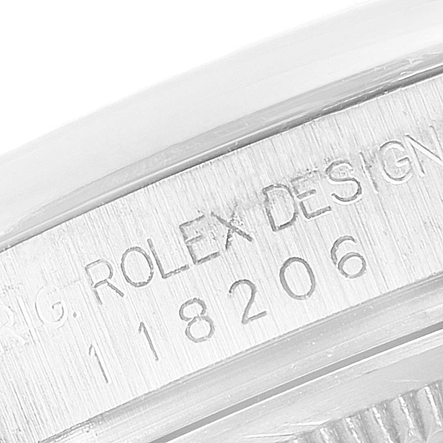 The image shows a close-up of the model number engraving on the side of a President model Rolex watch.
