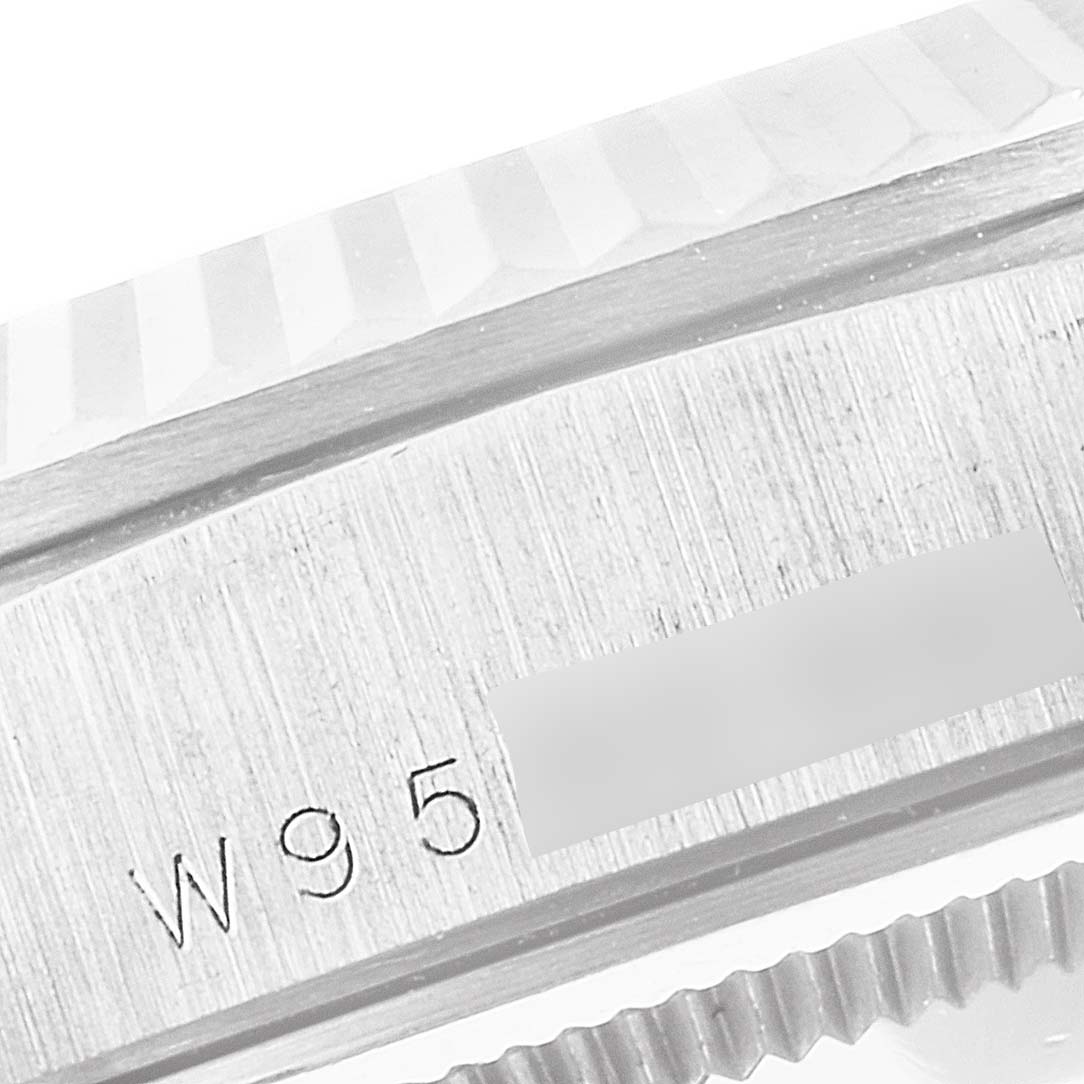 The image shows a close-up of the serial number and fluted bezel of a Rolex President 18239 Men
s White Gold Silver Dial 18239 Men
s White Gold Silver Dial model watch.