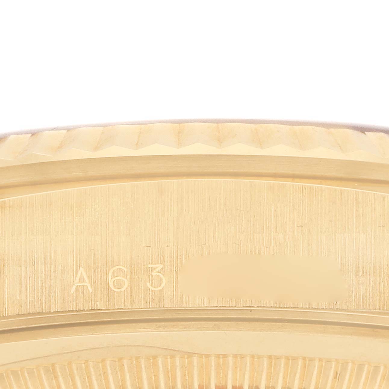 The image shows a close-up of the side of a Rolex President 18238 Men's Yellow Gold Brown Dial watch, highlighting the bezel and part of the case with engraved markings.
