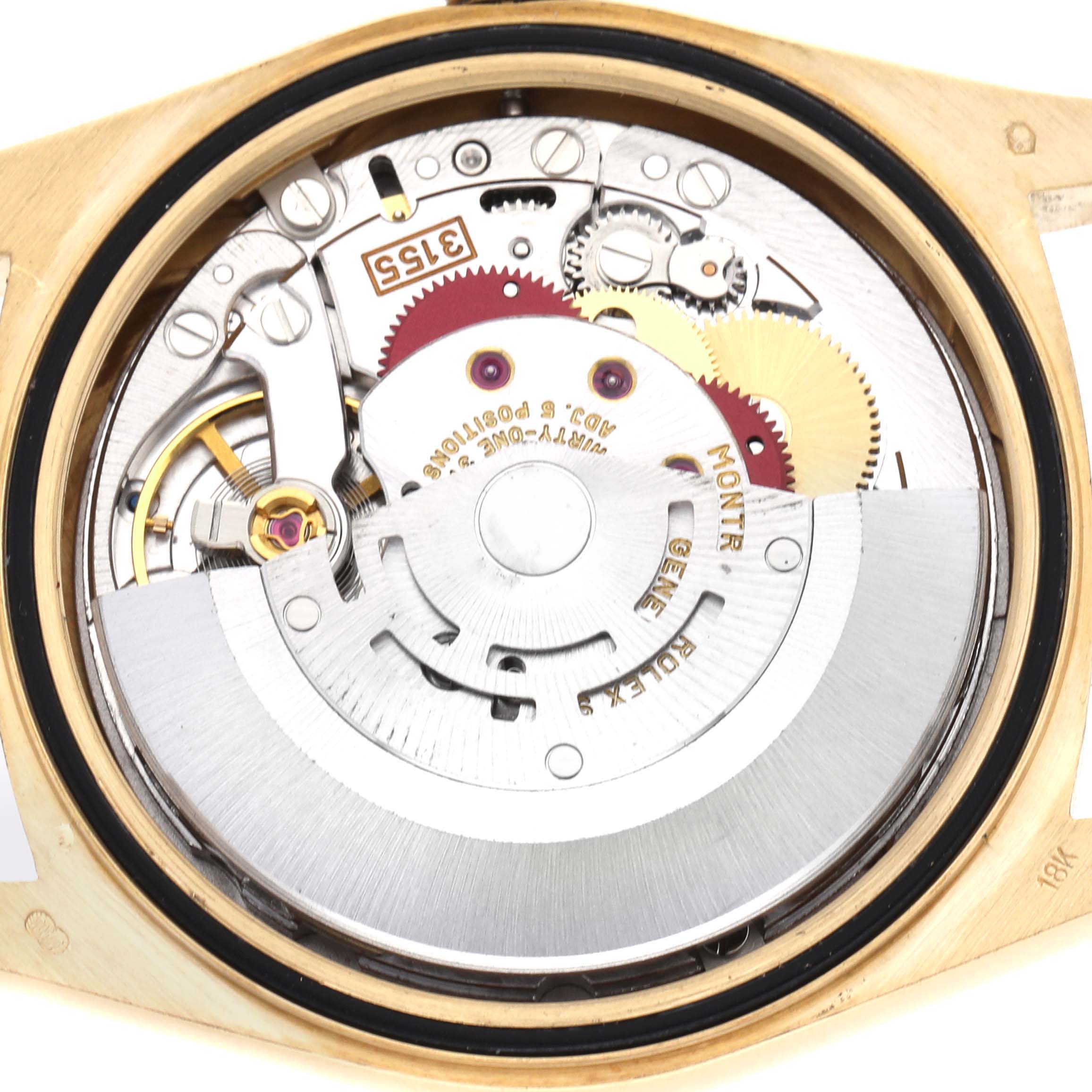 The image shows the internal mechanism of a Rolex President 18238 Men's Yellow Gold Brown Dial model from a rear angle, highlighting the movement and gears.