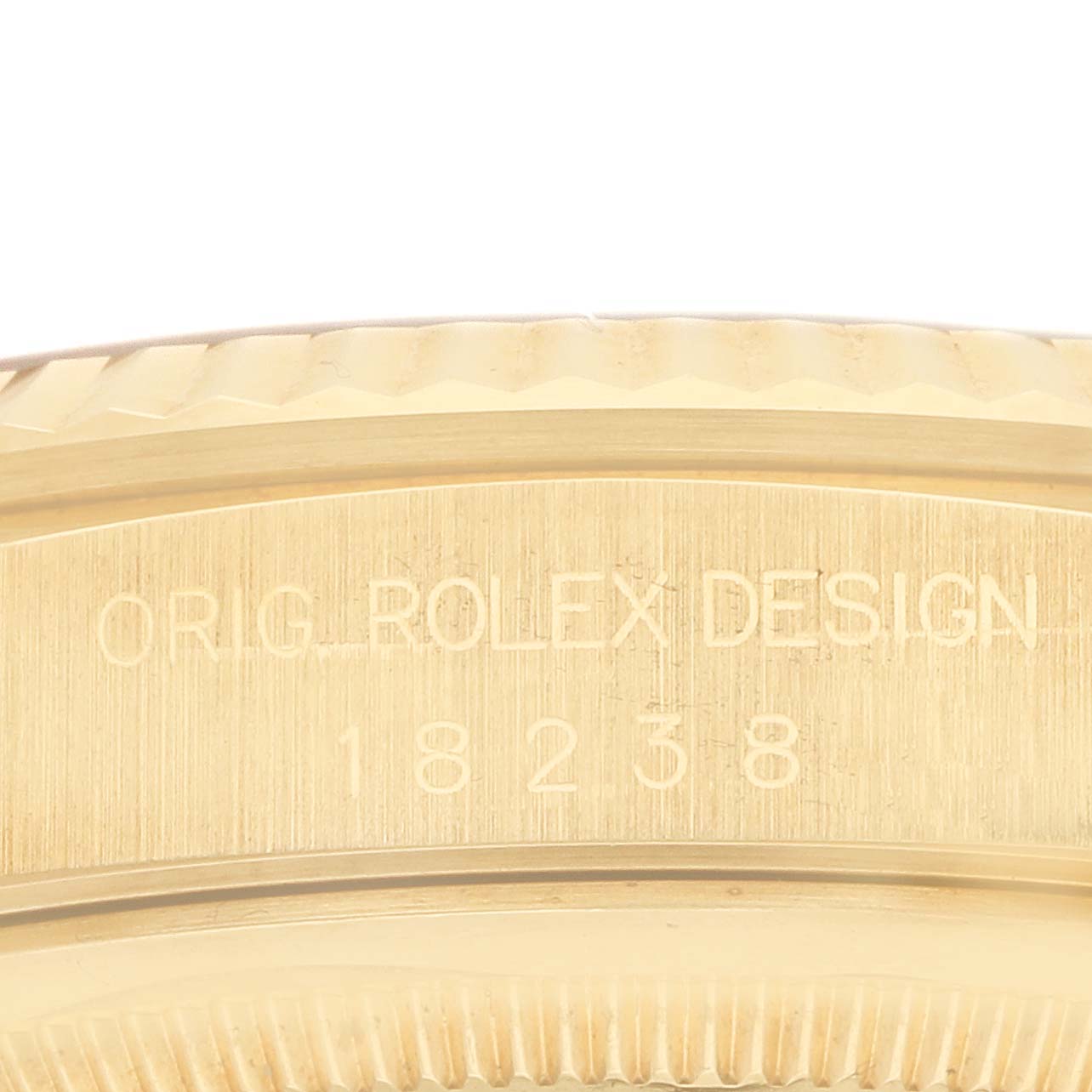 The image shows a close-up of the gold case edge of a Rolex President 18238 Men's Yellow Gold Brown Dial model, highlighting the "ORIG ROLEX DESIGN" engraving.