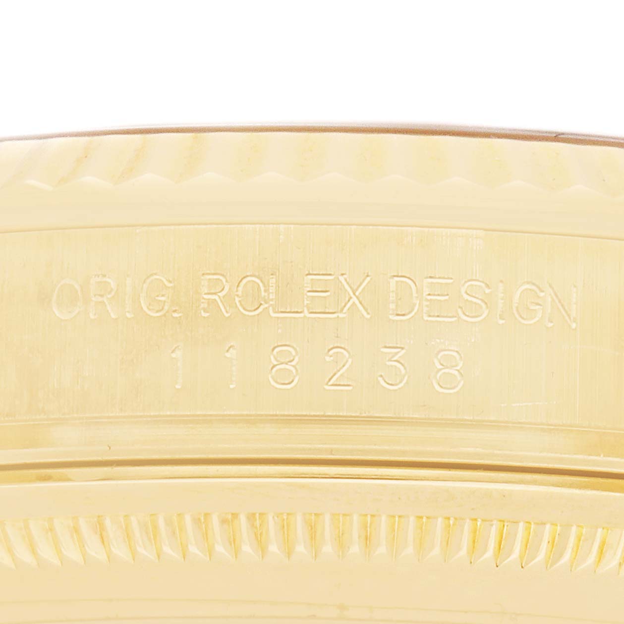 The image shows a close-up of the side of a Rolex President 118238 Men's Yellow Gold Black Dial watch, focusing on the engraved model number.
