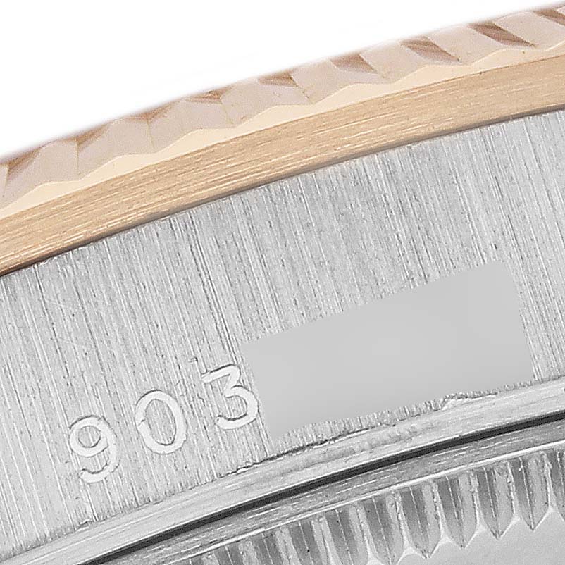 The image shows a close-up of the bezel and part of the case for a Rolex President 68279B Women's White Gold Champagne Dial 68279B Women's White Gold Champagne Dial watch.