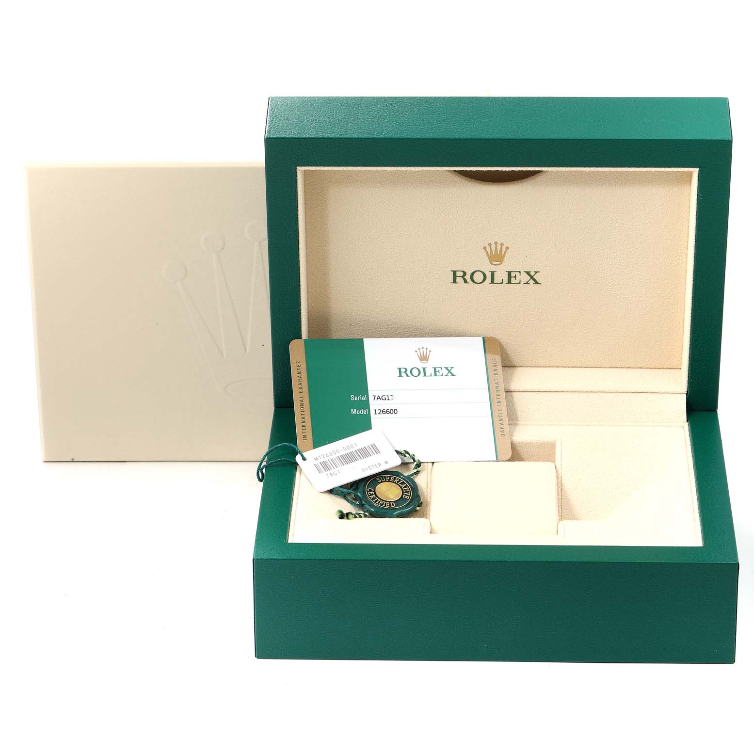 The image shows the opened packaging of a Rolex Sea-Dweller 126600 Men
s Stainless Steel Black Dial 126600 Men
s Stainless Steel Black Dial watch, including the box, a certification card, and a tag.