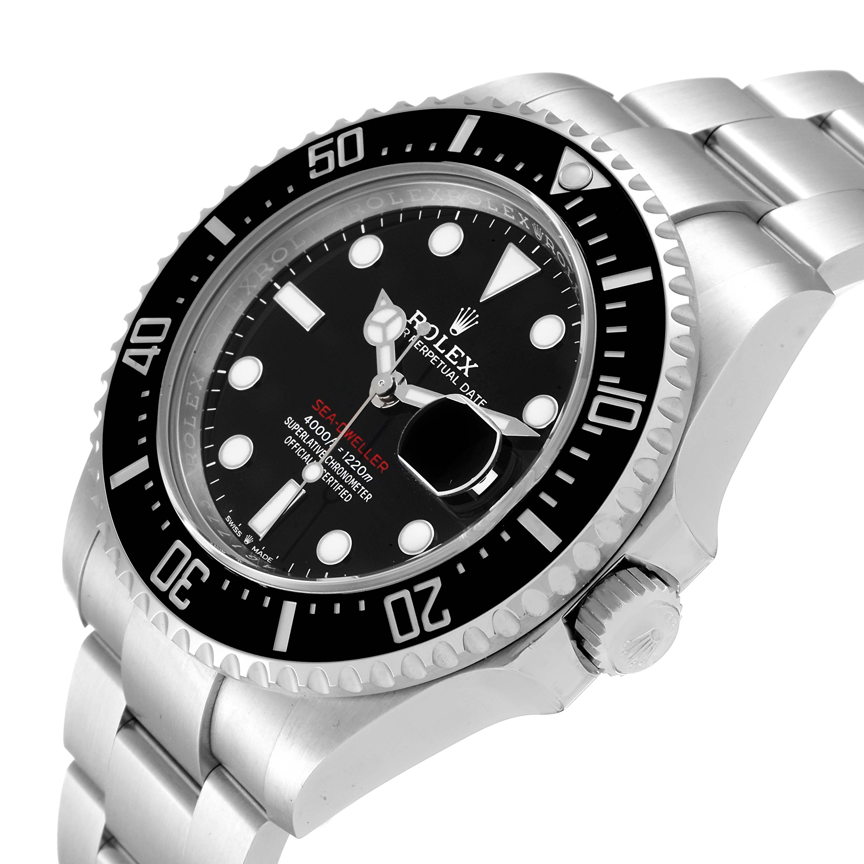 The Rolex Sea-Dweller 126600 Men
s Stainless Steel Black Dial 126600 Men
s Stainless Steel Black Dial watch is shown at an angle displaying its face, bezel, crown, and part of the metal bracelet.