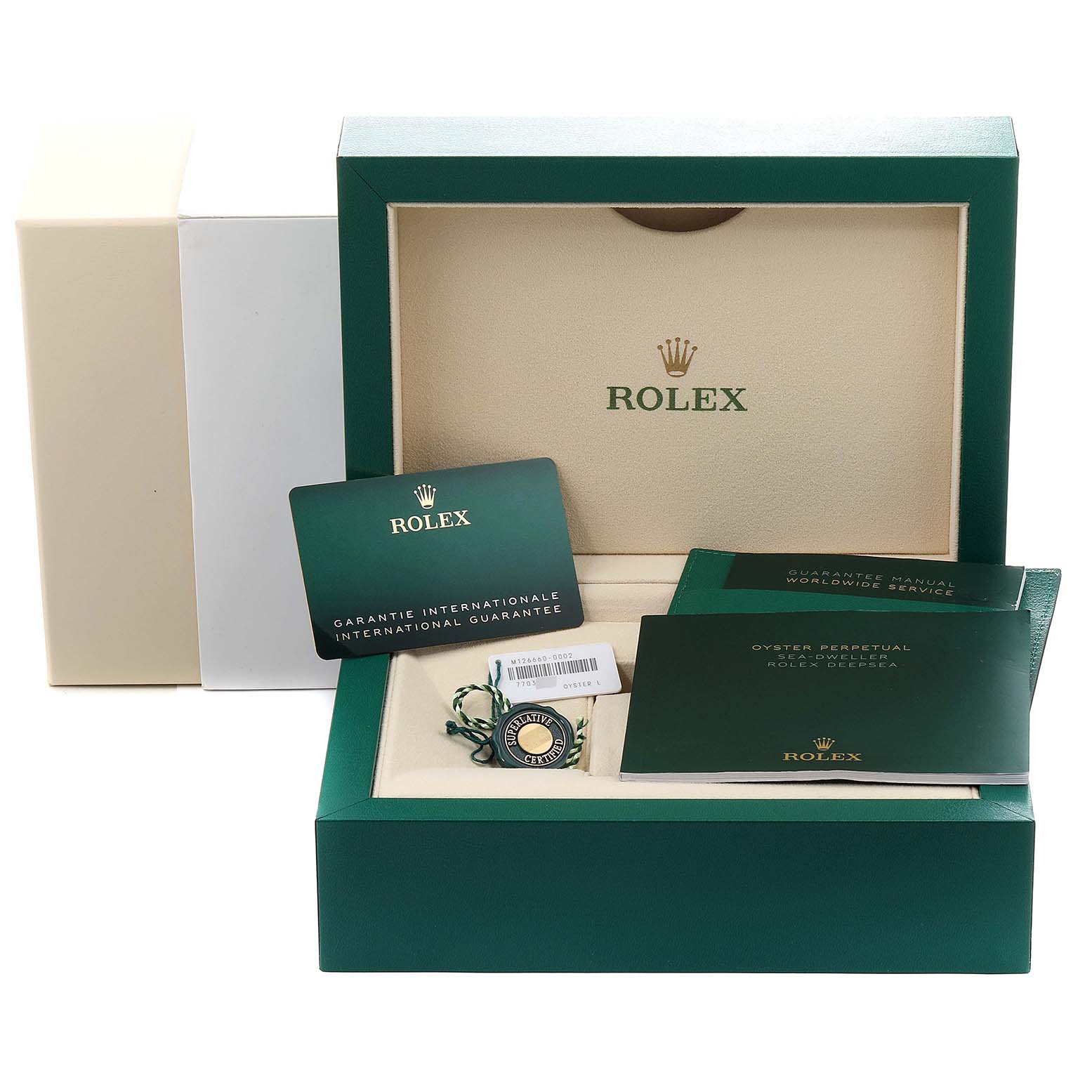 The image shows the accessories and documentation for a Rolex Sea-Dweller 126660 Men
s Stainless Steel Blue Dial 126660 Men
s Stainless Steel Blue Dial watch, including a box, guarantee card, and manuals.