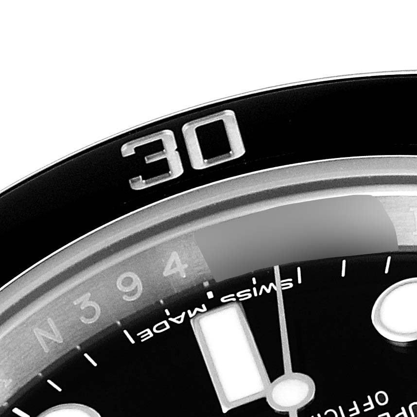 The image shows a close-up of the bezel and part of the dial of a Rolex Submariner 116610 Men
s Stainless Steel Black Dial 116610 Men
s Stainless Steel Black Dial.