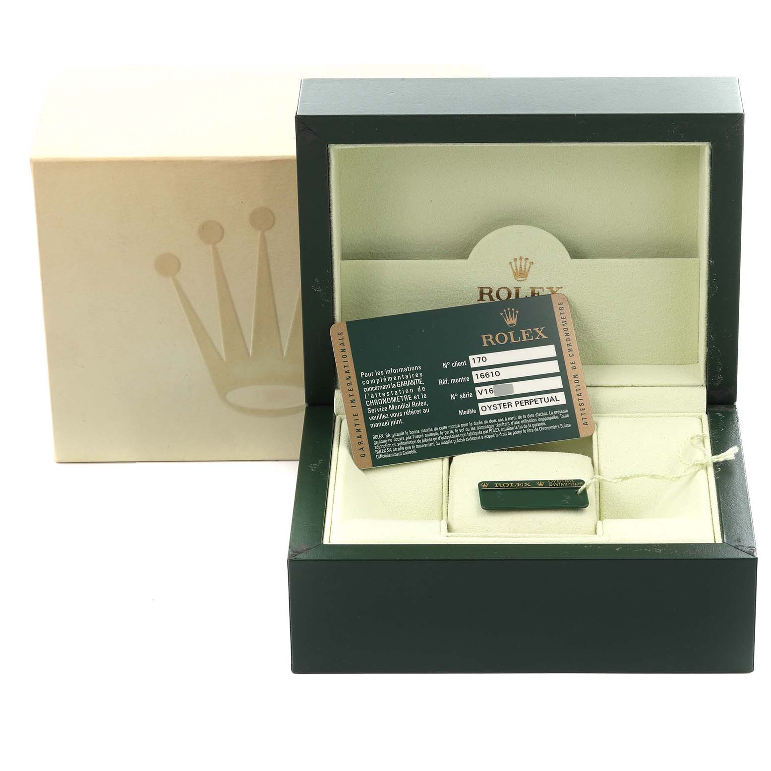 The image shows a Rolex Submariner 16610 Men
s Stainless Steel Black Dial 16610 Men
s Stainless Steel Black Dial box, warranty card, and accessories from a top-down angle.