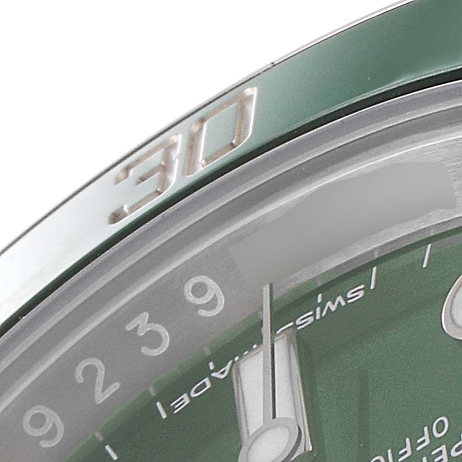 The close-up image shows the green bezel and part of the dial with the hand and markings on a Rolex Submariner 116610LV Men
s Stainless Steel Green Dial 116610LV Men
s Stainless Steel Green Dial watch.