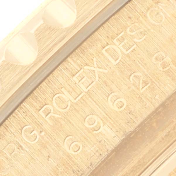 The image shows a close-up of the engraved edge and markings on a Rolex Yacht-Master 169628 Women's Yellow Gold Grey Dial 169628 Women's Yellow Gold Grey Dial watch.