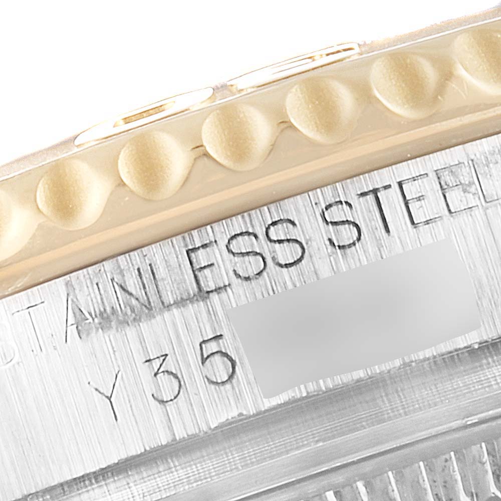 The image shows a close-up of the side of a Rolex Yacht-Master 168623 Men's Steel and Gold (two tone) White Dial 168623 Men's Steel and Gold (two tone) White Dial watch, focusing on the engravings and bezel edge.