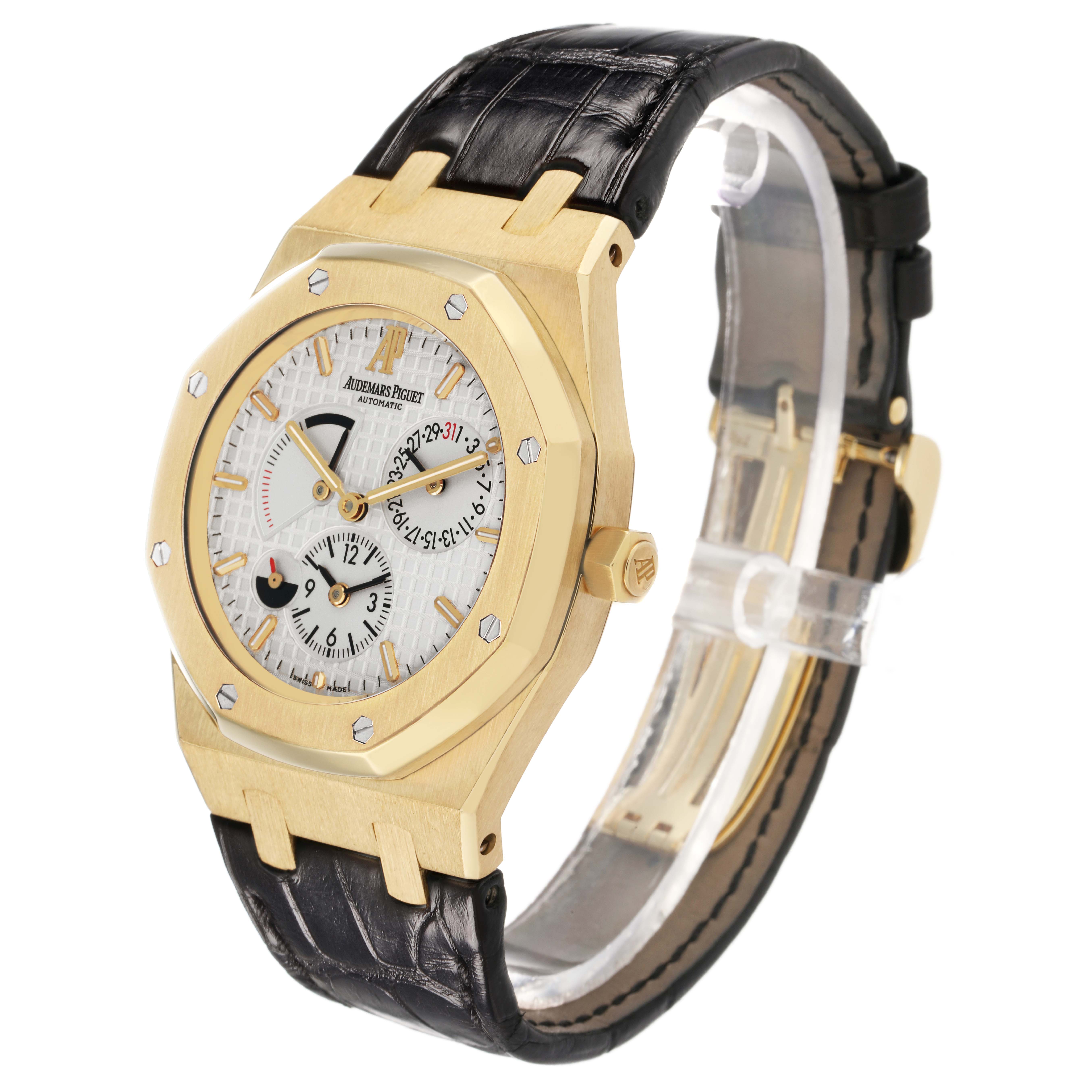 The Audemars Piguet Royal Oak 26120BA Men's Yellow Gold Silver Dial watch is shown at a three-quarter angle, displaying the face, bezel, and part of the strap.