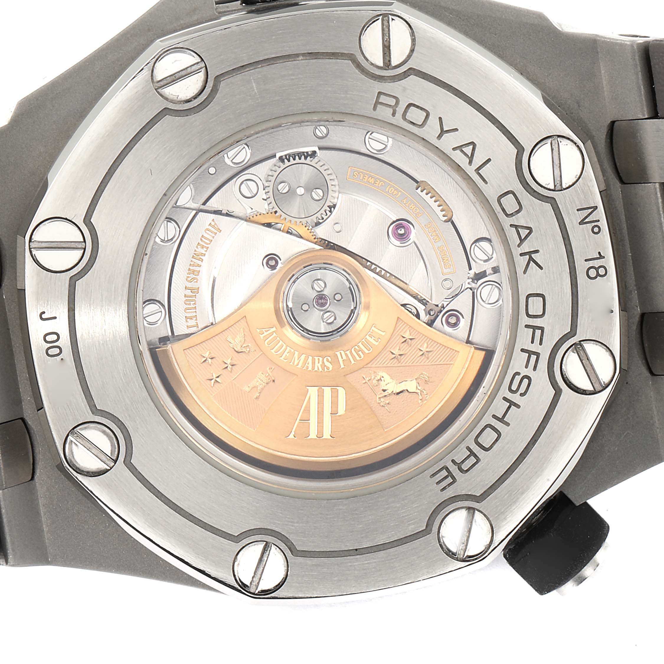 The image shows the back case of an Audemars Piguet Royal Oak Offshore 15710ST.00.A002CA.02 Men's Stainless Steel White Dial 15710ST.00.A002CA.02 Men's Stainless Steel White Dial watch, highlighting its visible rotor and screws.