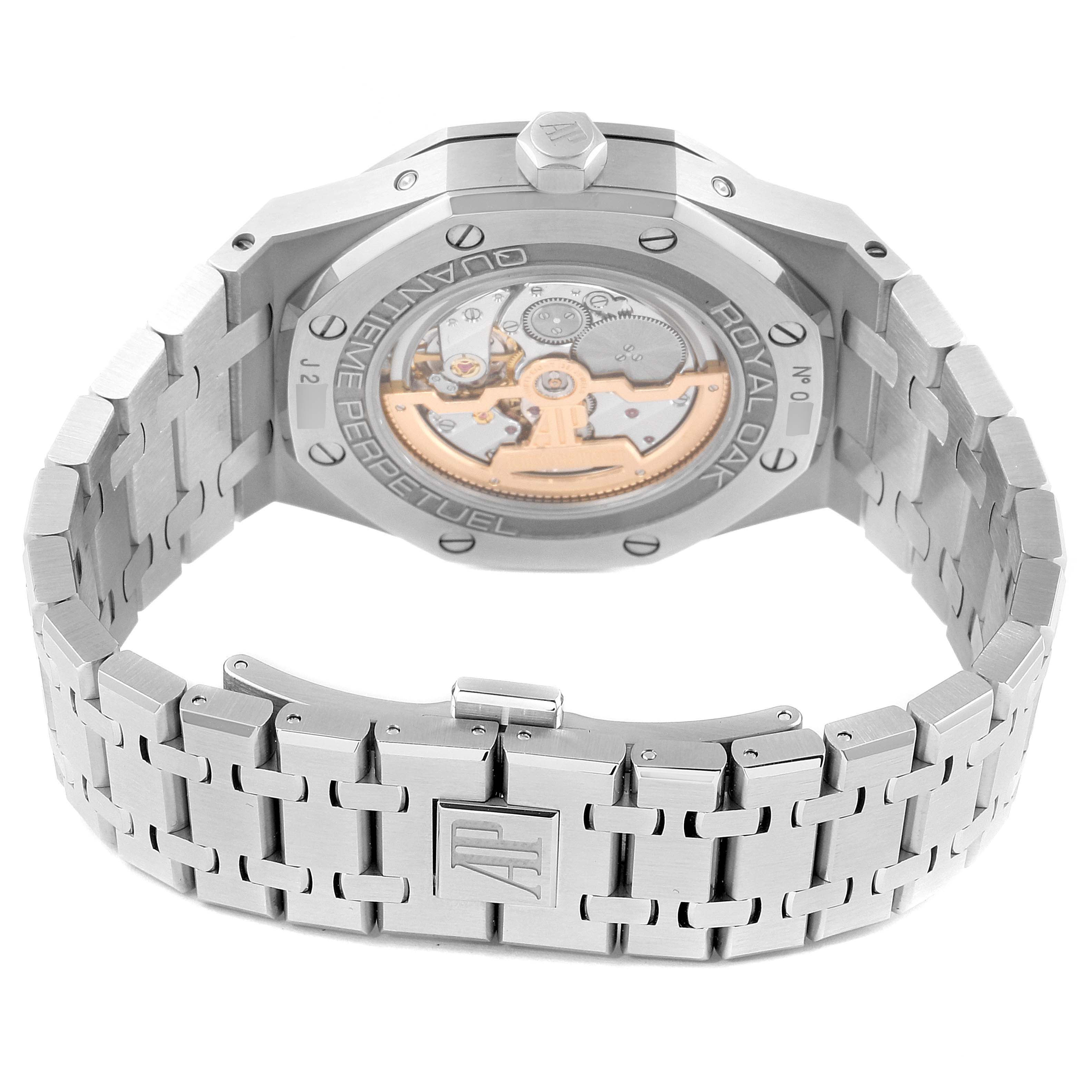 The image shows the rear angle of an Audemars Piguet Royal Oak 26574ST.OO.1220ST.01 Men's Stainless Steel Silver Dial 26574ST.OO.1220ST.01 Men's Stainless Steel Silver Dial watch, highlighting the movement and stainless steel bracelet.