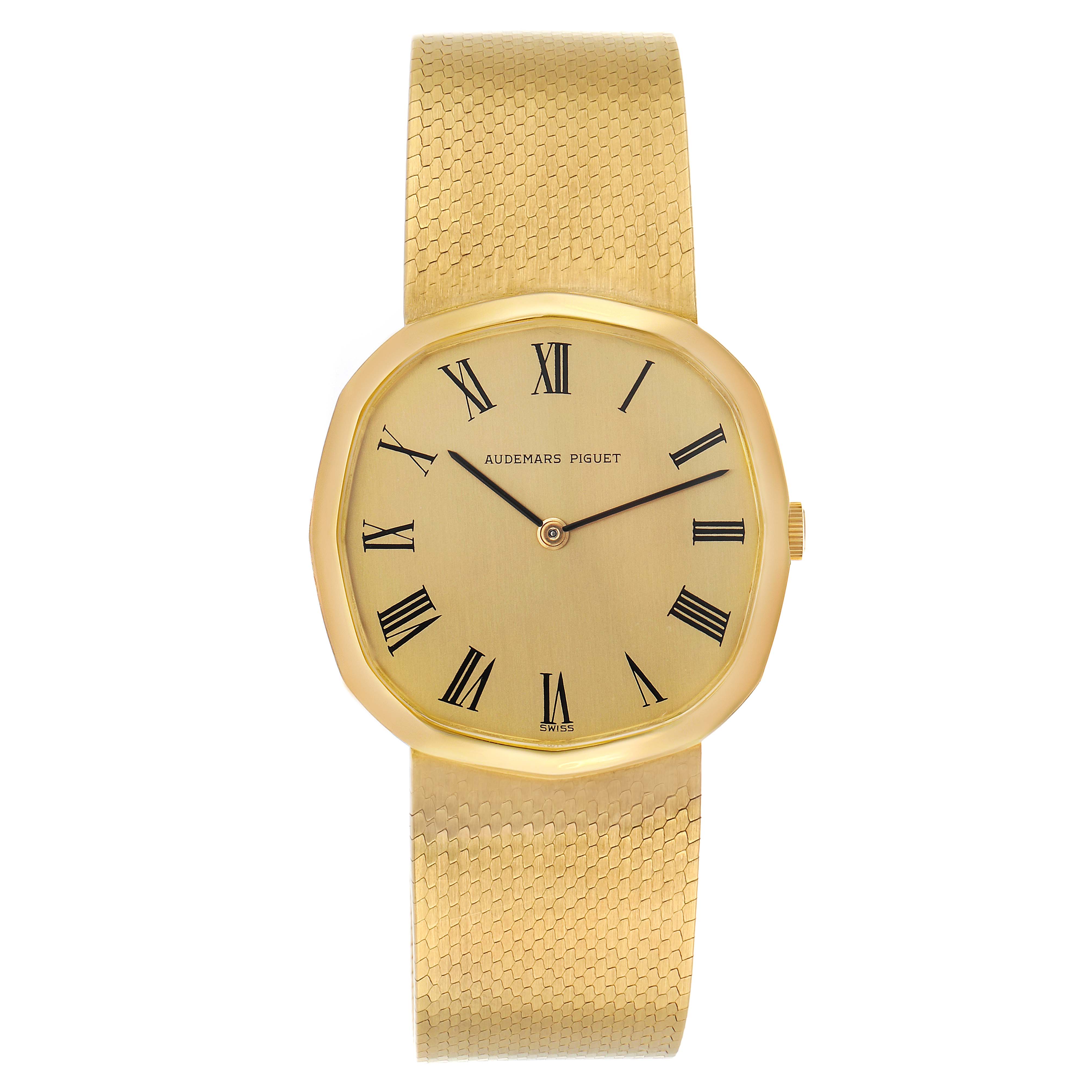 The Audemars Piguet Vintage Men's Yellow Gold Champagne Dial watch is shown from the front, displaying its gold case, Roman numeral dial, and mesh strap.