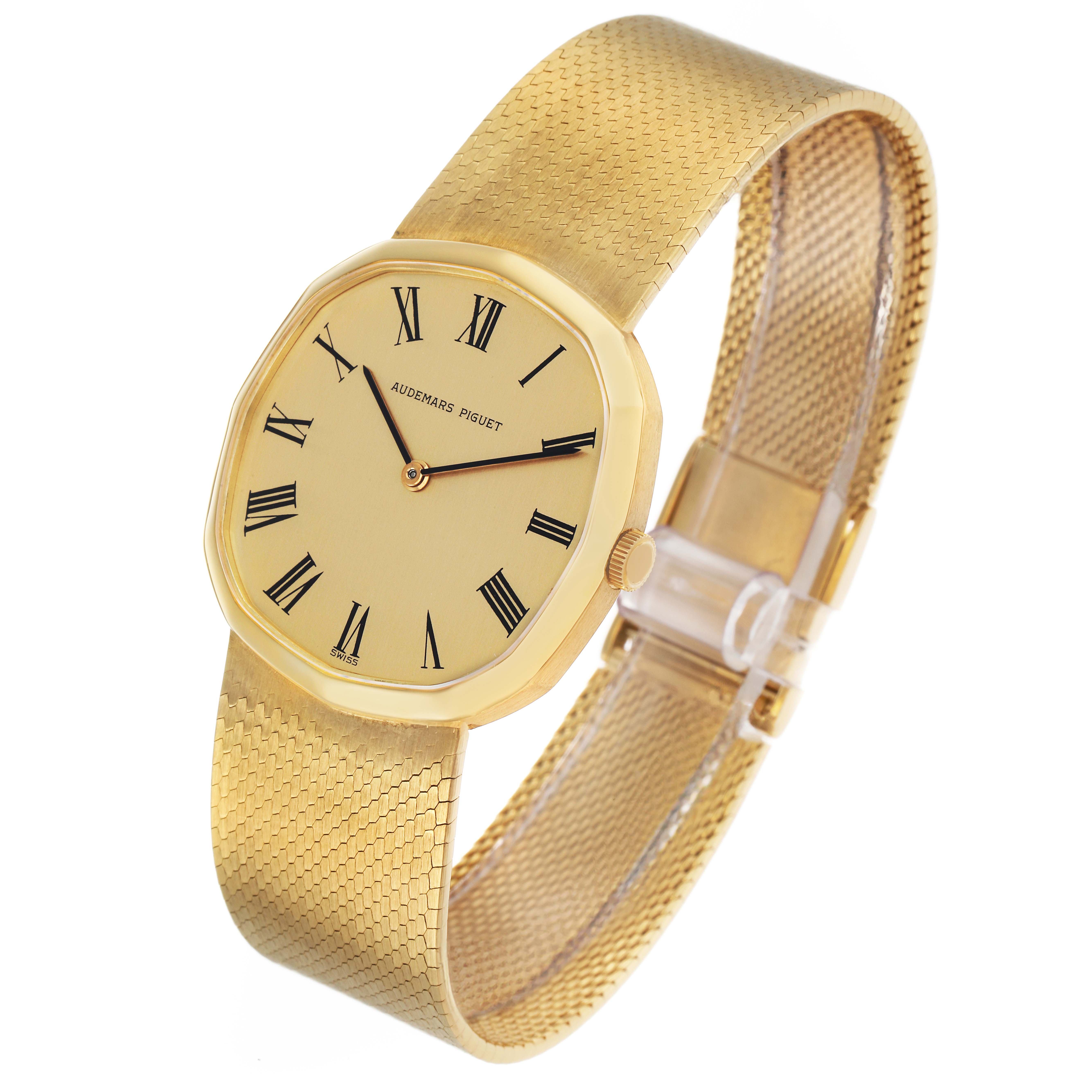 The Vintage Audemars Piguet watch is shown at an angled view, highlighting the face, Roman numerals, case, crown, and textured bracelet.