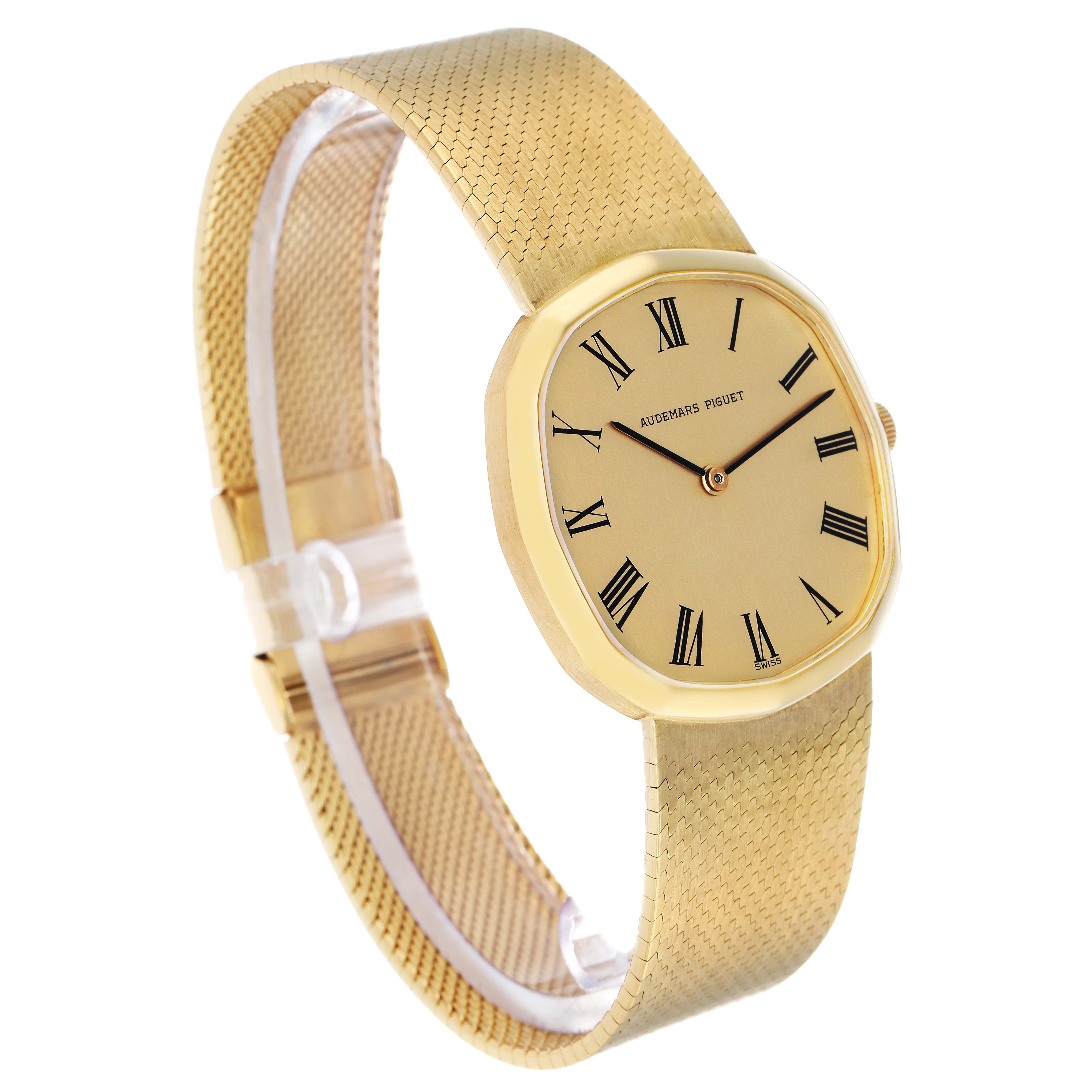 The Audemars Piguet Vintage Men's Yellow Gold Champagne Dial watch is shown at a three-quarter angle, highlighting its face, bezel, and textured strap.