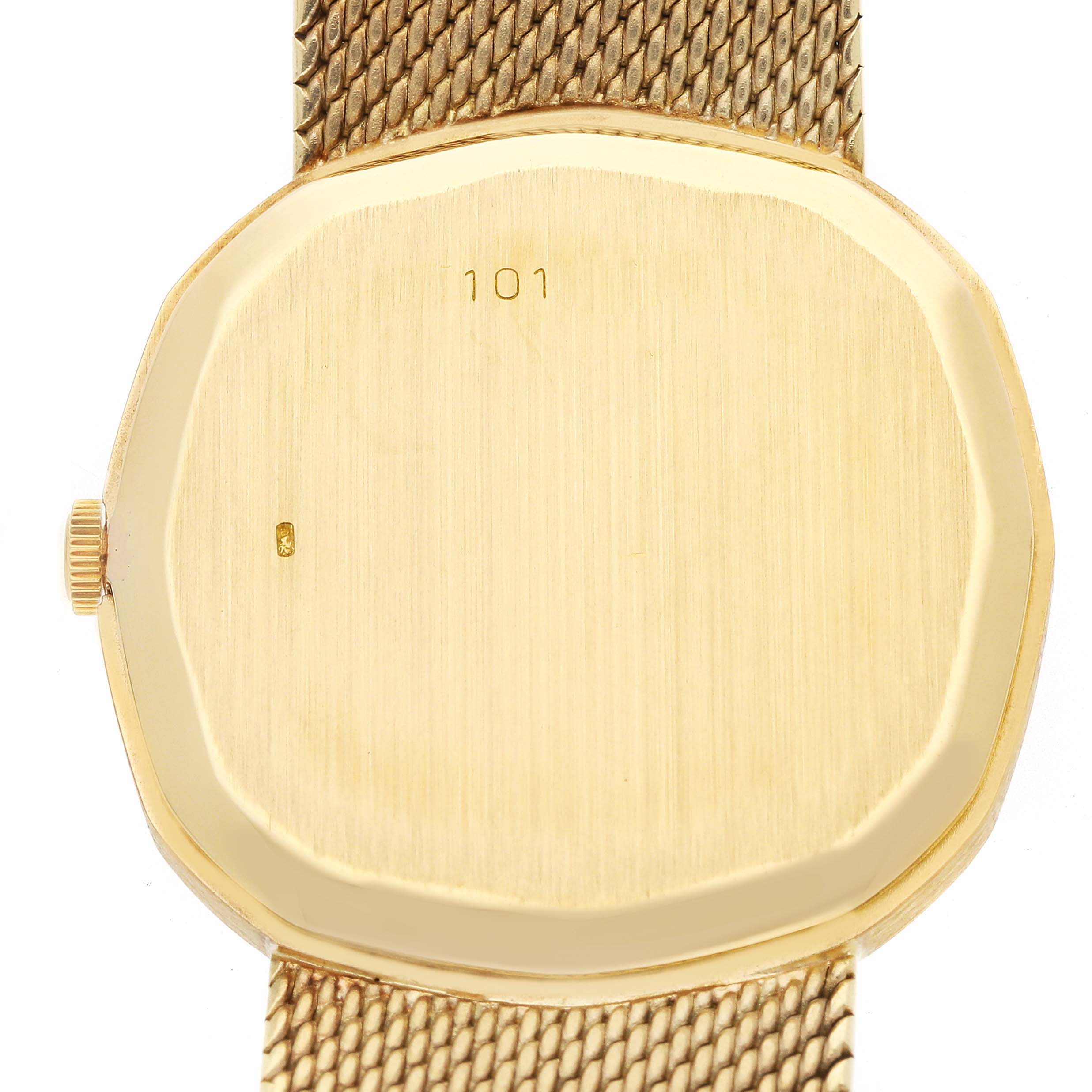 The image shows the back of a Vintage Audemars Piguet watch, highlighting its gold case and mesh strap.