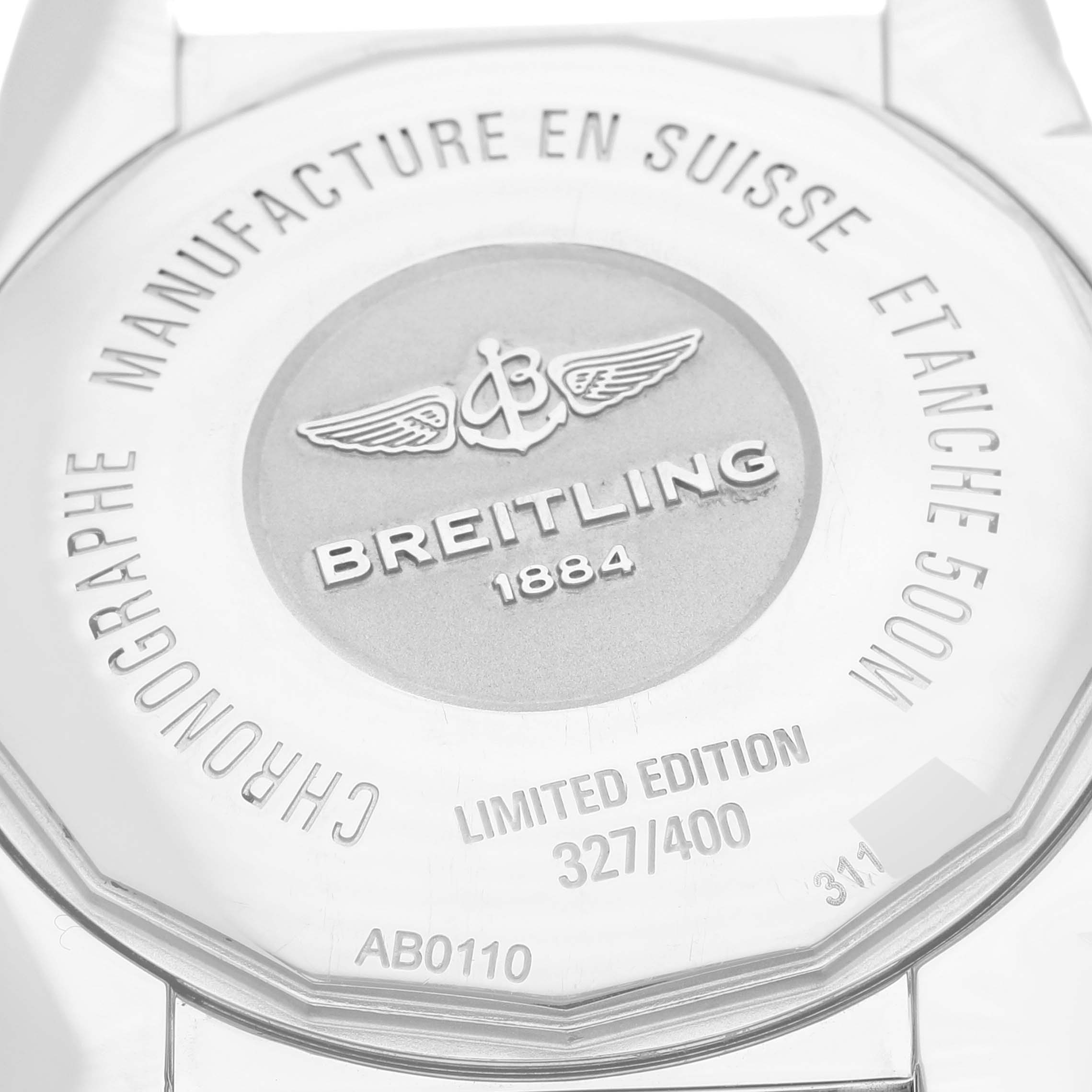 This image shows the back of a limited edition Breitling Chronomat AB0110 Men's Stainless Steel Mother of Pearl Dial AB0110 Men's Stainless Steel Mother of Pearl Dial watch, highlighting its branding and serial number.