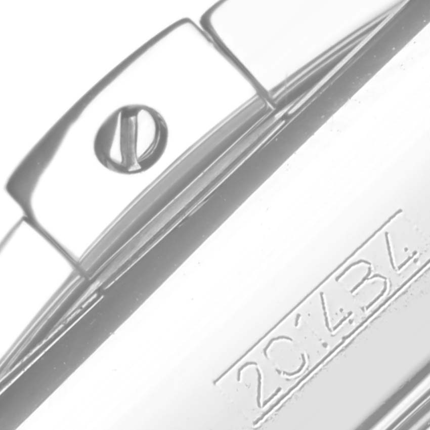 The image shows a close-up of a screw and serial number on the side of a Breitling Chronomat AB01154G/BD13 Men's Stainless Steel Black Dial AB01154G/BD13 Men's Stainless Steel Black Dial watch case.