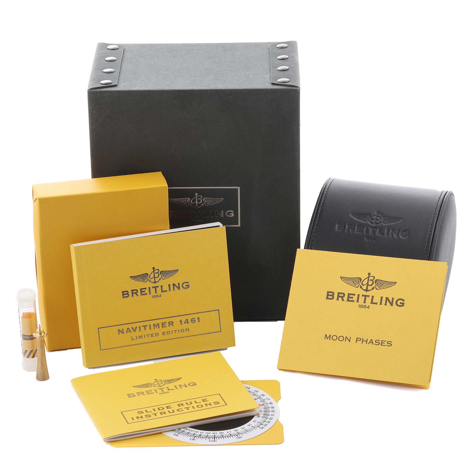 The image shows the packaging and accessories for a Breitling Chronomat A13356 Men's Stainless Steel Mother of Pearl Dial A13356 Men's Stainless Steel Mother of Pearl Dial, including booklets, a case, and a box.